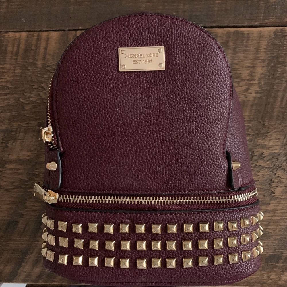 Michael Kors mini backpack in the color plum